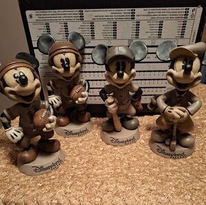 Disney bobbleheads, 3 athletic venues-  2 football, 1 golf, 1 baseball.